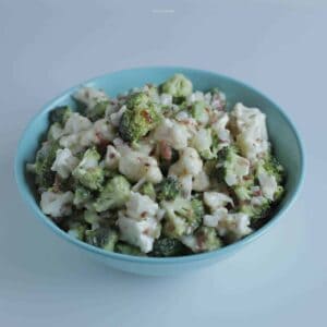 This fresh and crunchy broccoli and cauliflower salad is delicious with bacon bits in a tangy sweet sauce