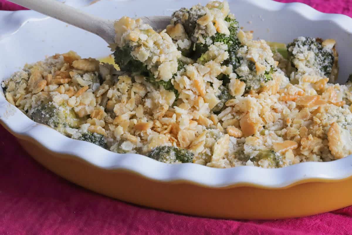 This broccoli and cheese casserole features melted cheesy Velveeta with buttery cracker crumbs on top.