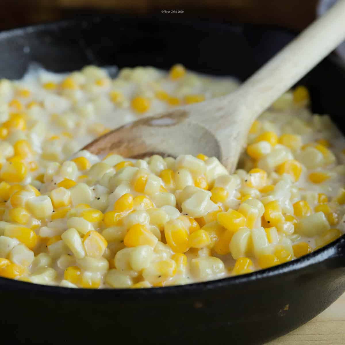 This southern sweet creamed corn features both yellow and white corn kernels for variation in the dish.