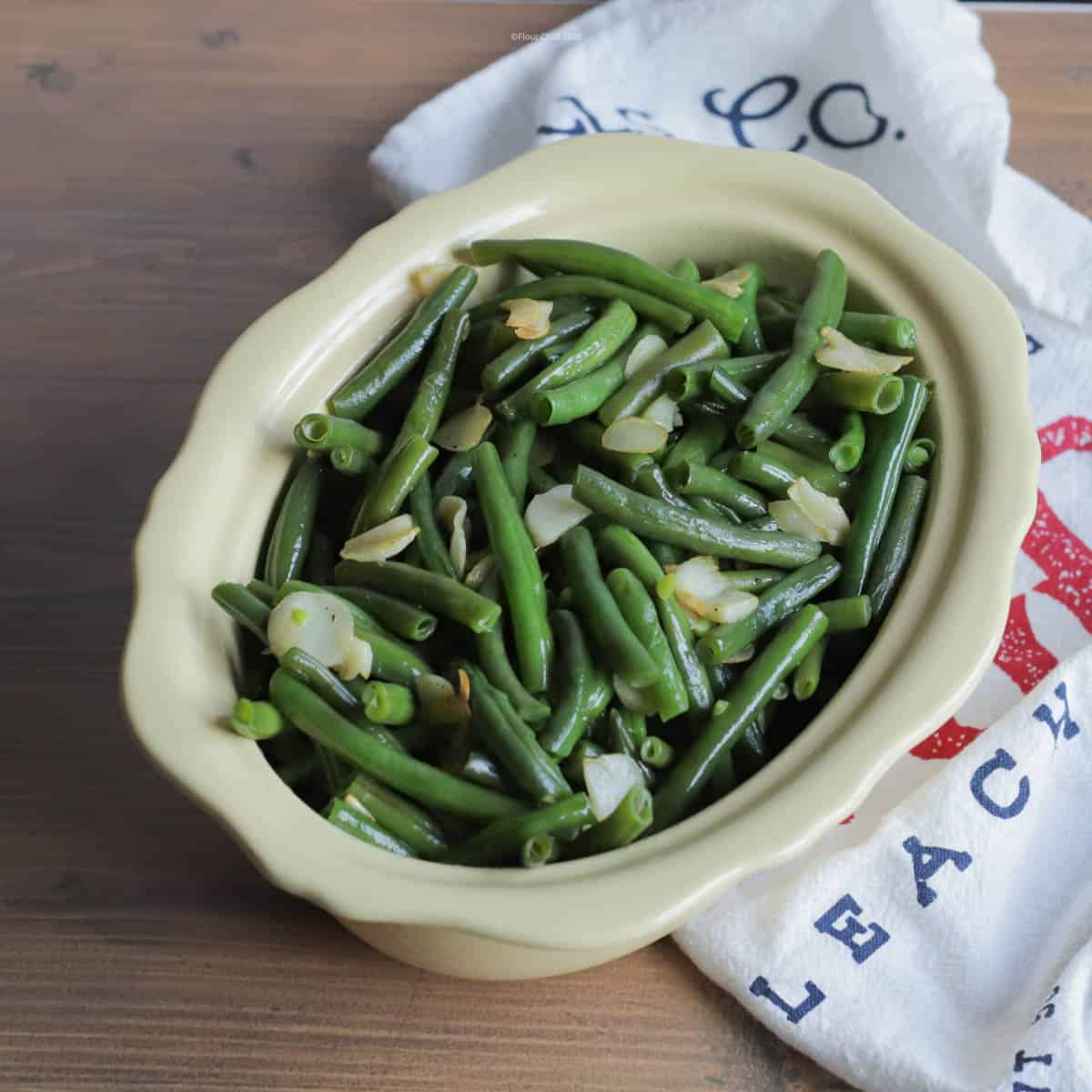 Fresh green beans with sautéed garlic slices make a farm fresh side dish