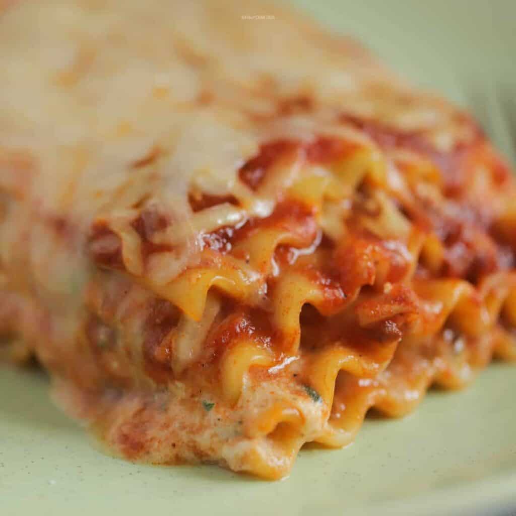 Very closeup picture of lasagna with noodles and cheese