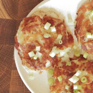 Hearty leftover mashed potato pancakes on a mid century plate