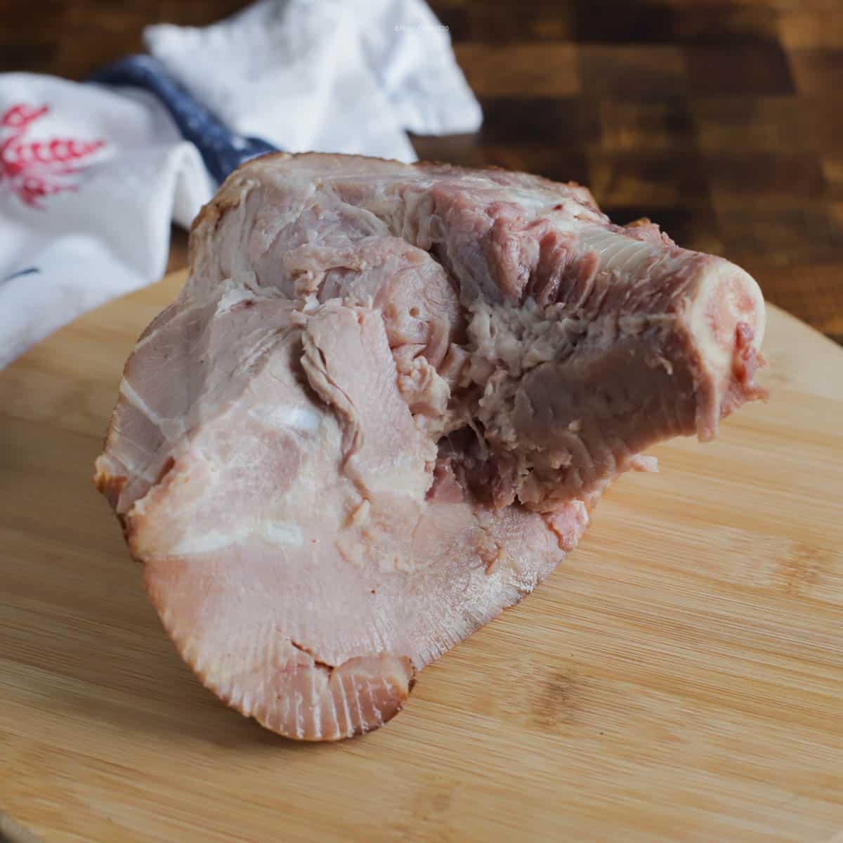 A large soup bone on a cutting board