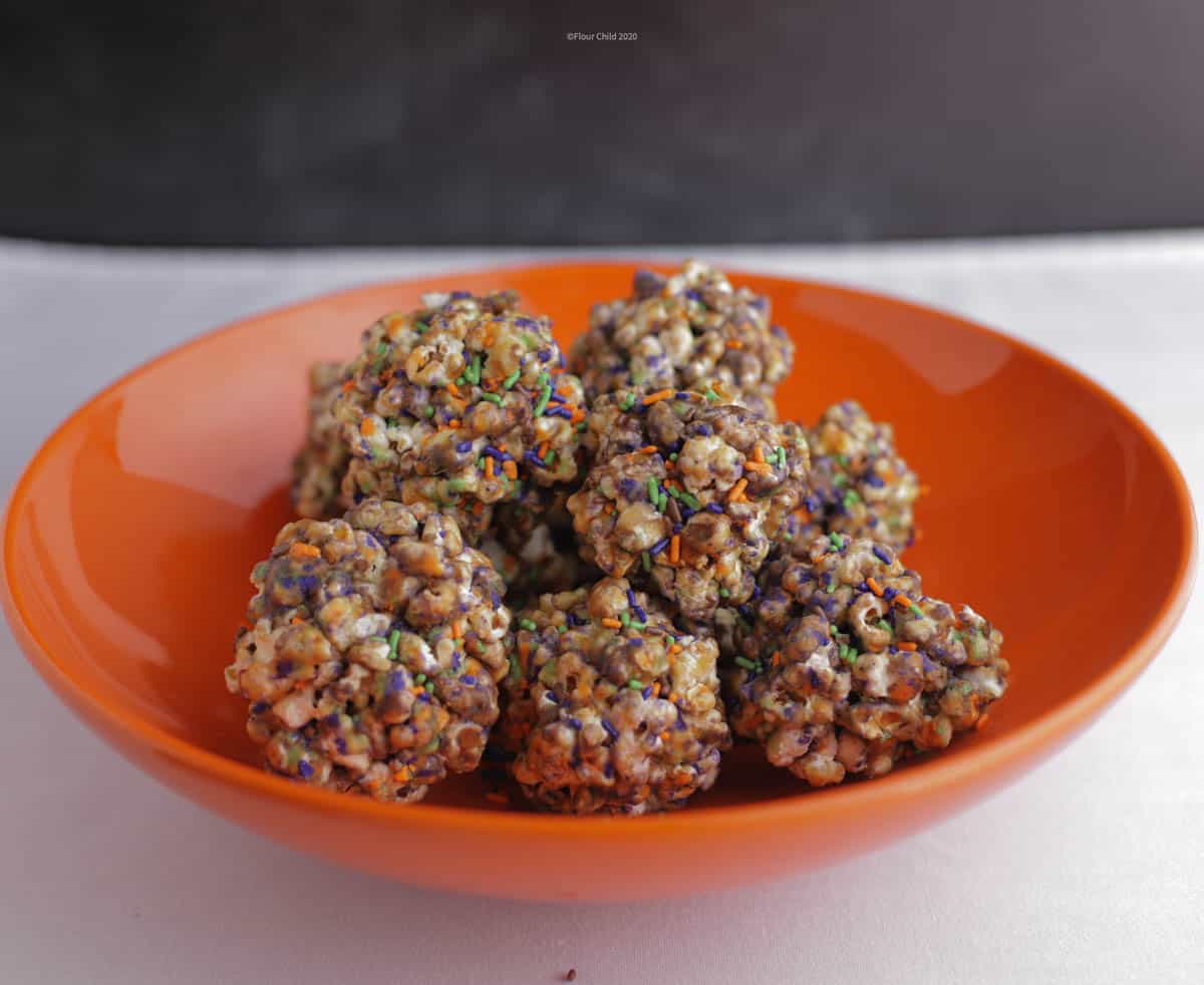 Old fashioned popcorn balls with melted candy stuck to them!