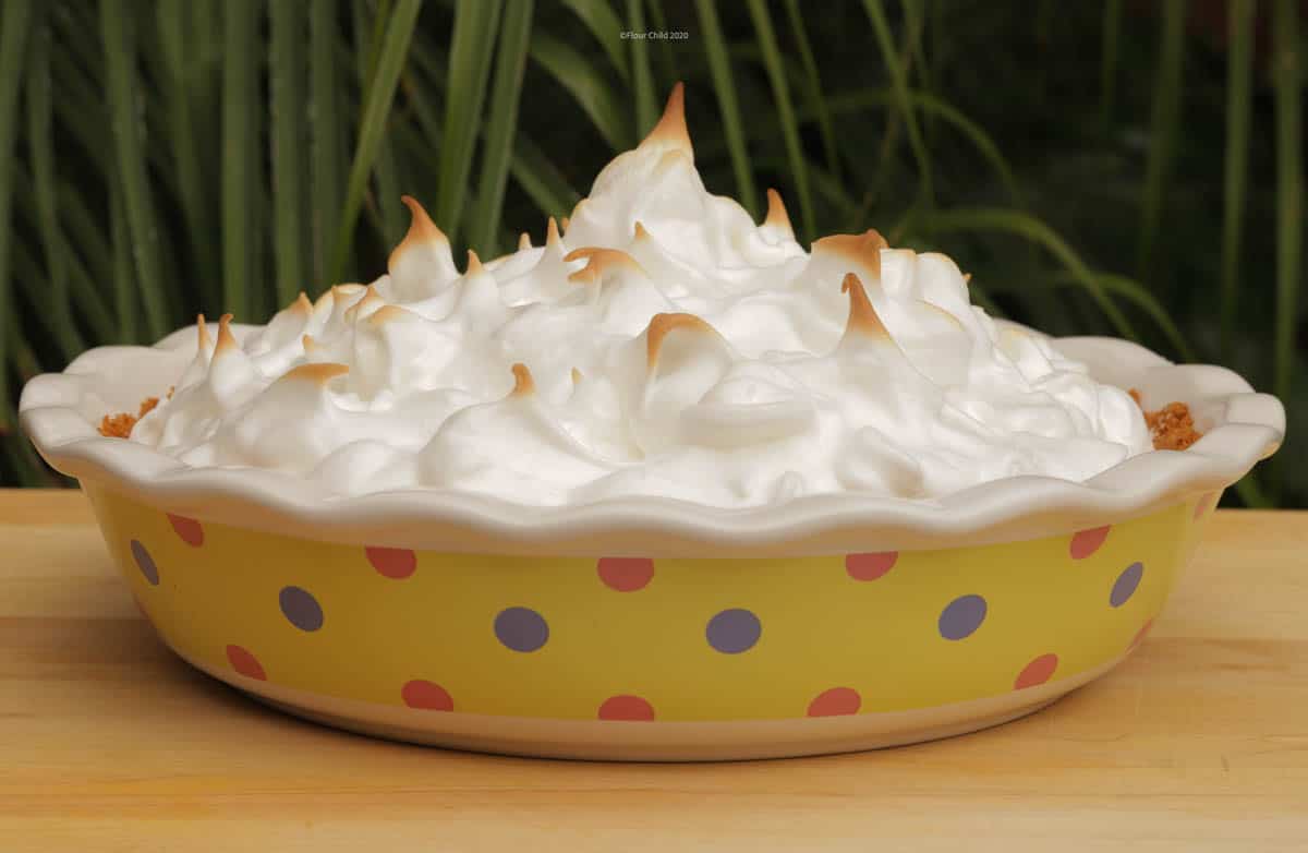 Key lime pie with meringue topping in a polka-dot pie plate 