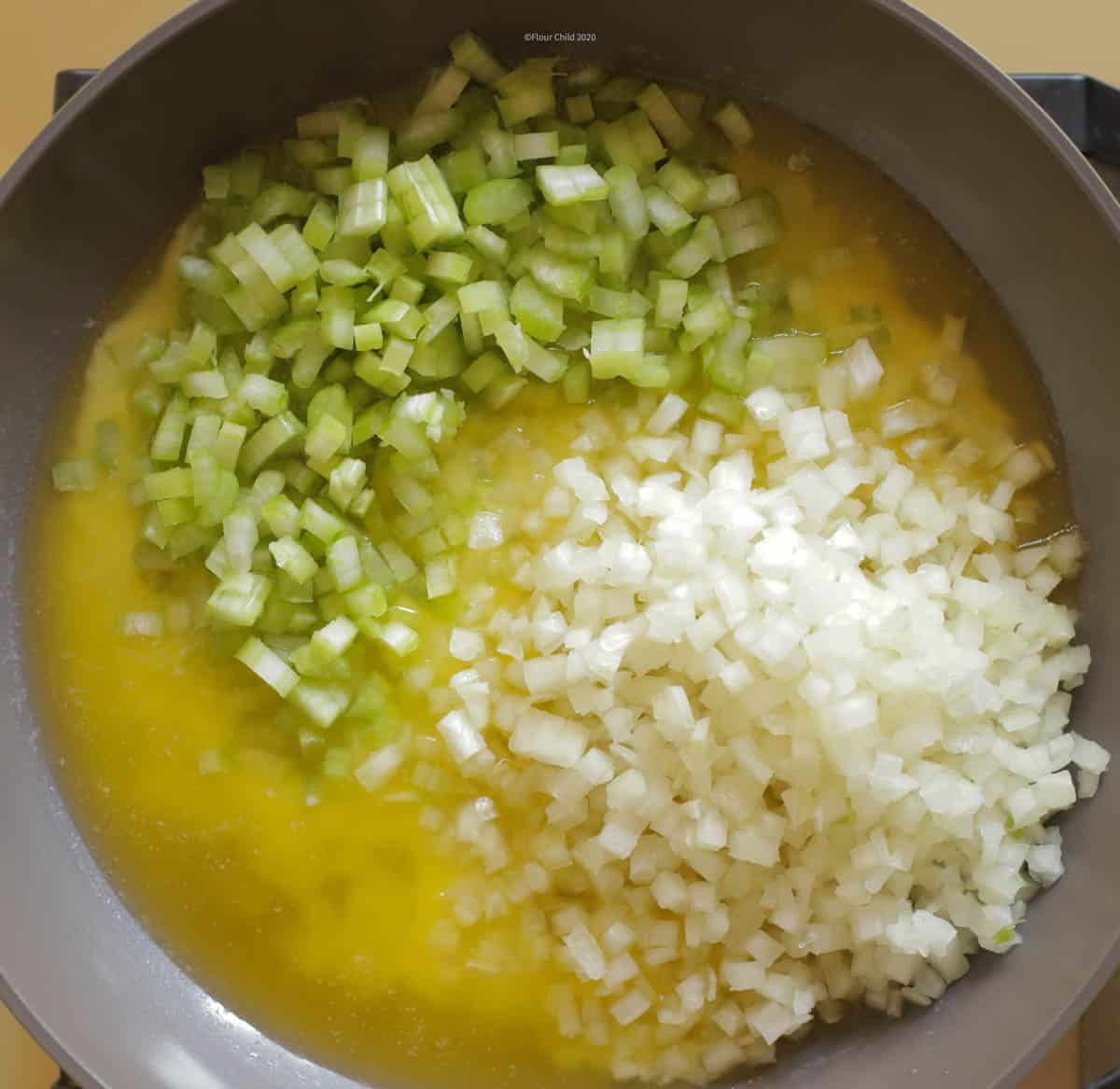 celery and onion added to butter in skillet