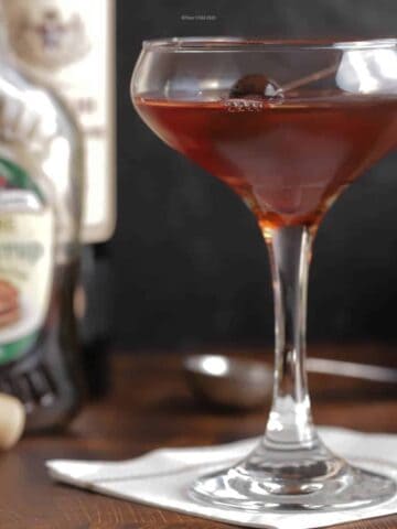 Closeup of a maple manhattan in a coupe glass