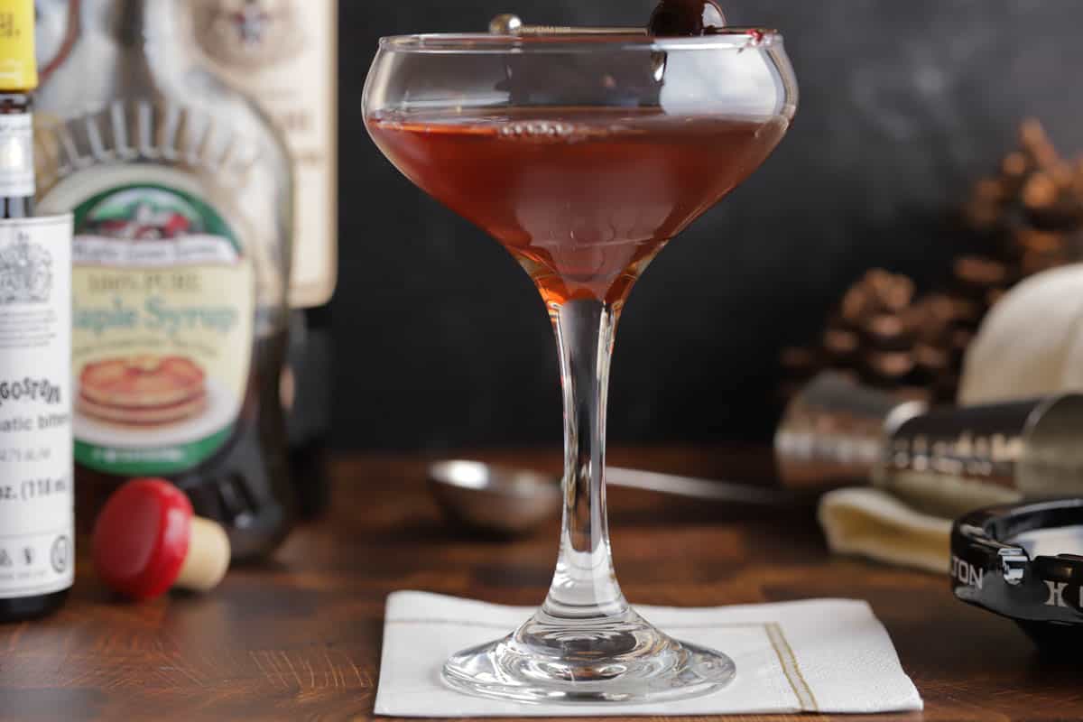 Closeup of a maple manhattan in a coupe glass