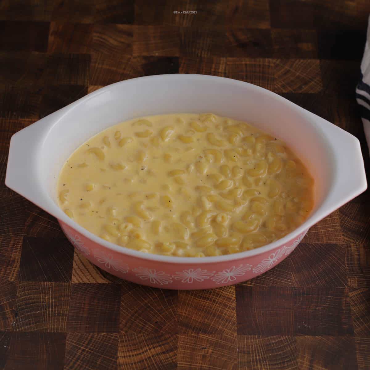 All macaroni and cheese ingredients combined in a casserole dish