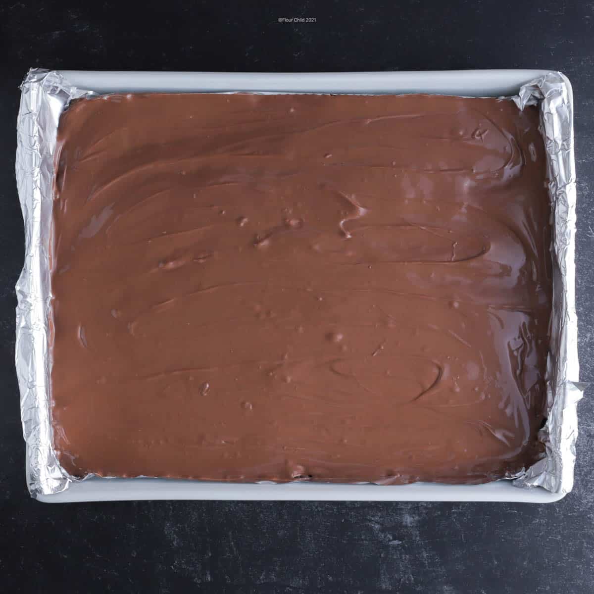 Chocolate frosting over top of oatmeal bars