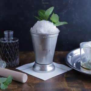 mint julep in a silver cup.