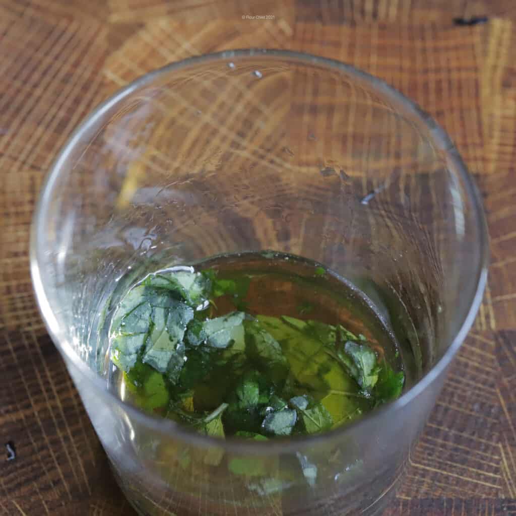 mint leaves muddled in simple syrup.