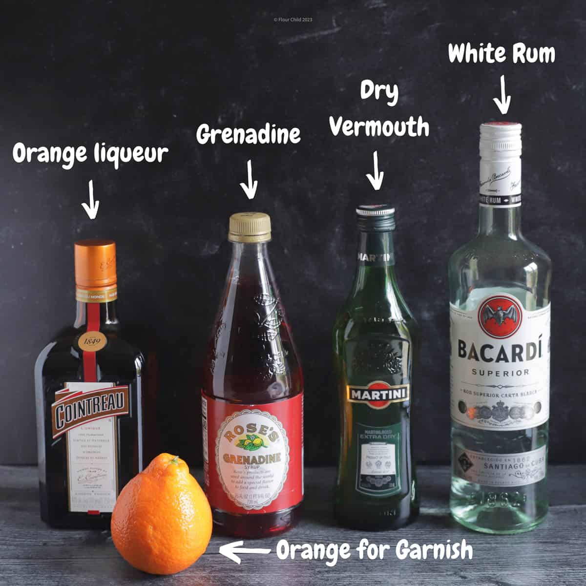 A picture of bottles of ingredients needed for an El President cocktail