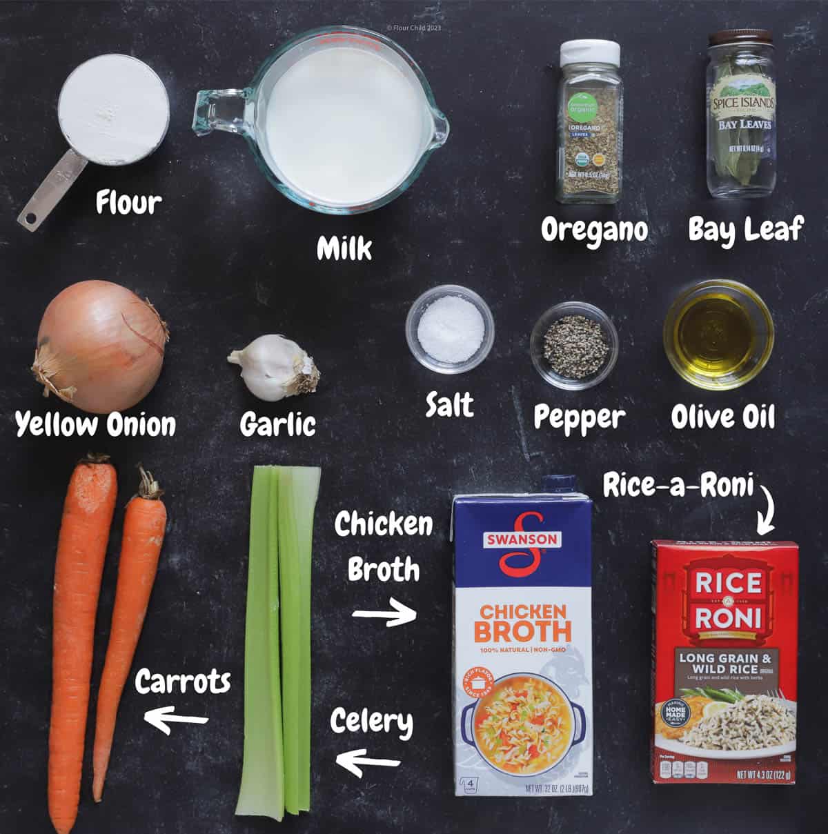 The ingredients for step 2 of cream of chicken and wild rice soup laid out on a black background.