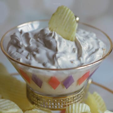 Lipton California Dip inside a small dipping bowl with a potato chip on the top for garnish.