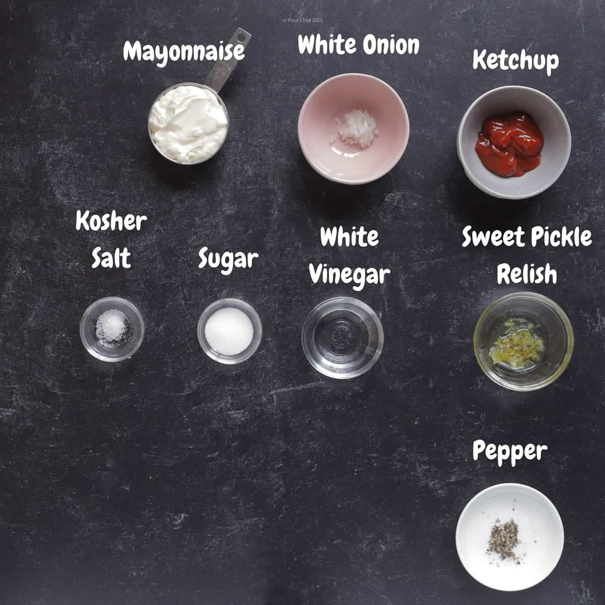 Thousand Island dressing ingredients on a black background