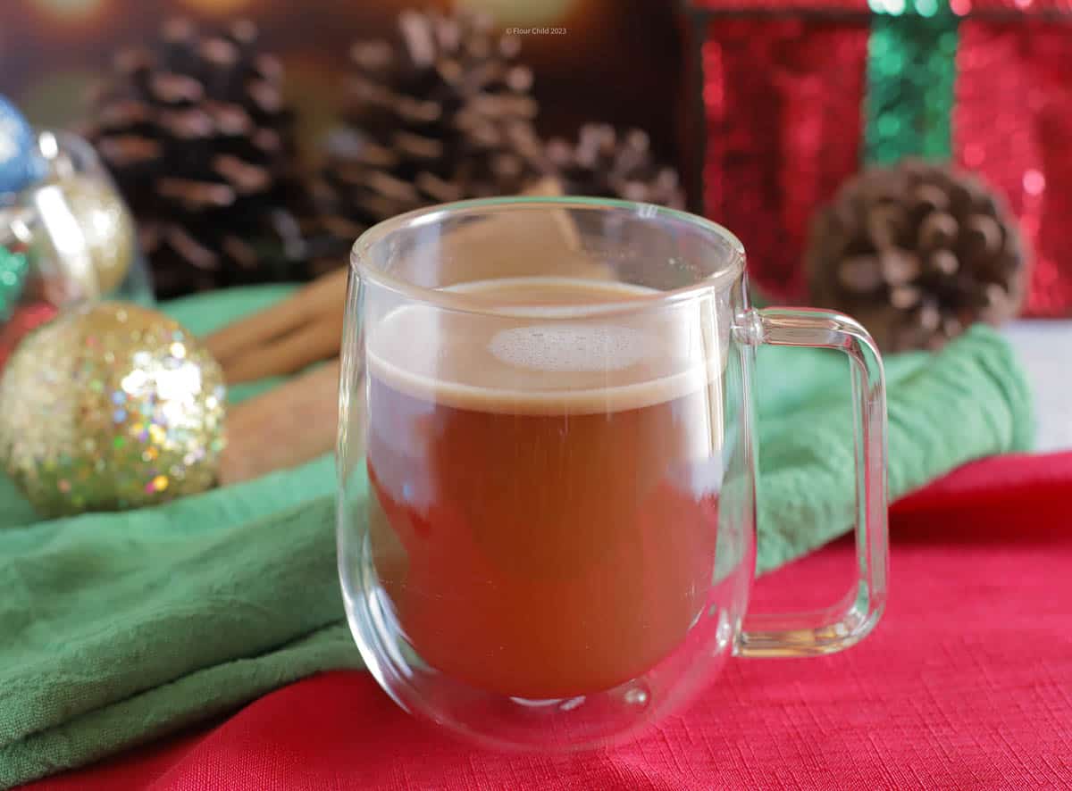 Clear mug of hot buttered bourbon